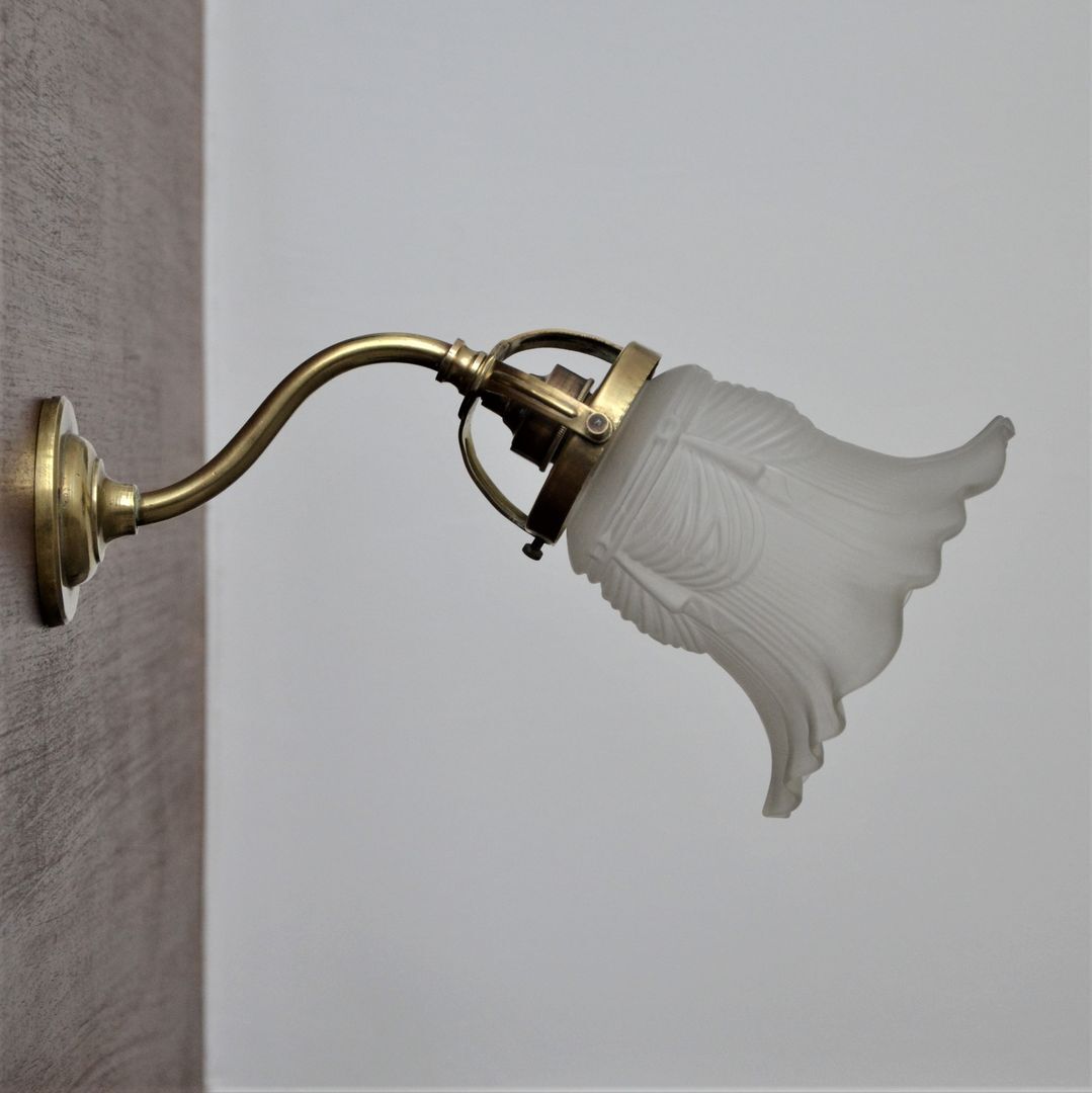 Brass gooseneck wall lamp and tulip lampshade