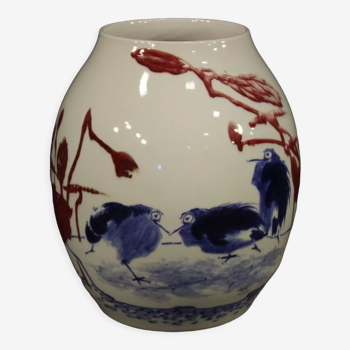 Chinese painted ceramic vase with floral and animal decorations