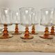 6 small amber-stemmed glasses