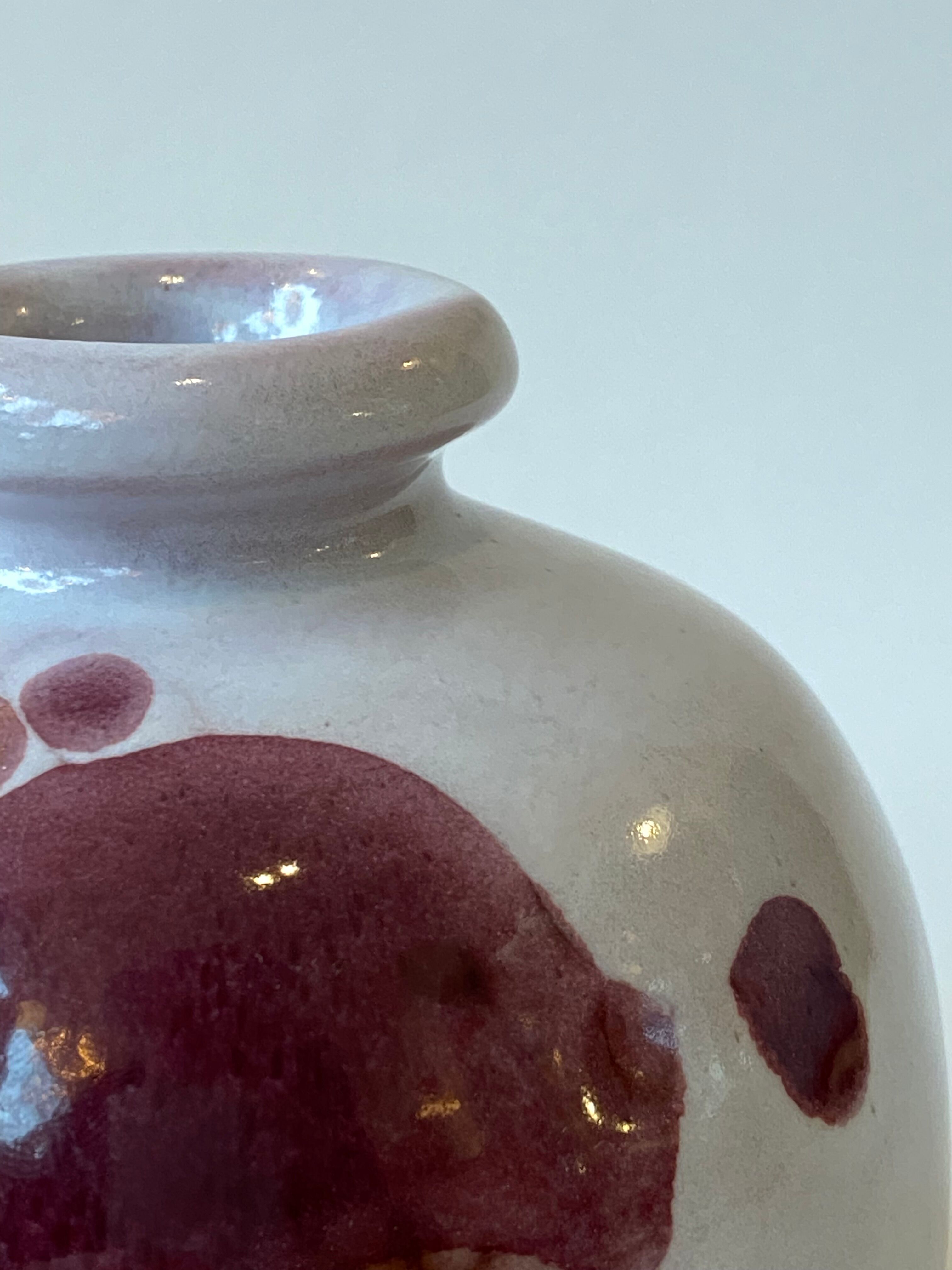 Ceramic vase by Jean and Robert Cloutier with fish decoration