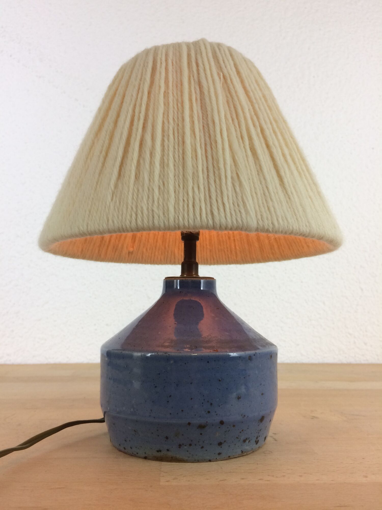 Blue ceramic lamp foot and white wool lampshade