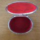 Metal jewelry box inside felt red floral decorations