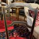 Set of four Napoleon III chairs in black lacquered wood with gold highlights.
