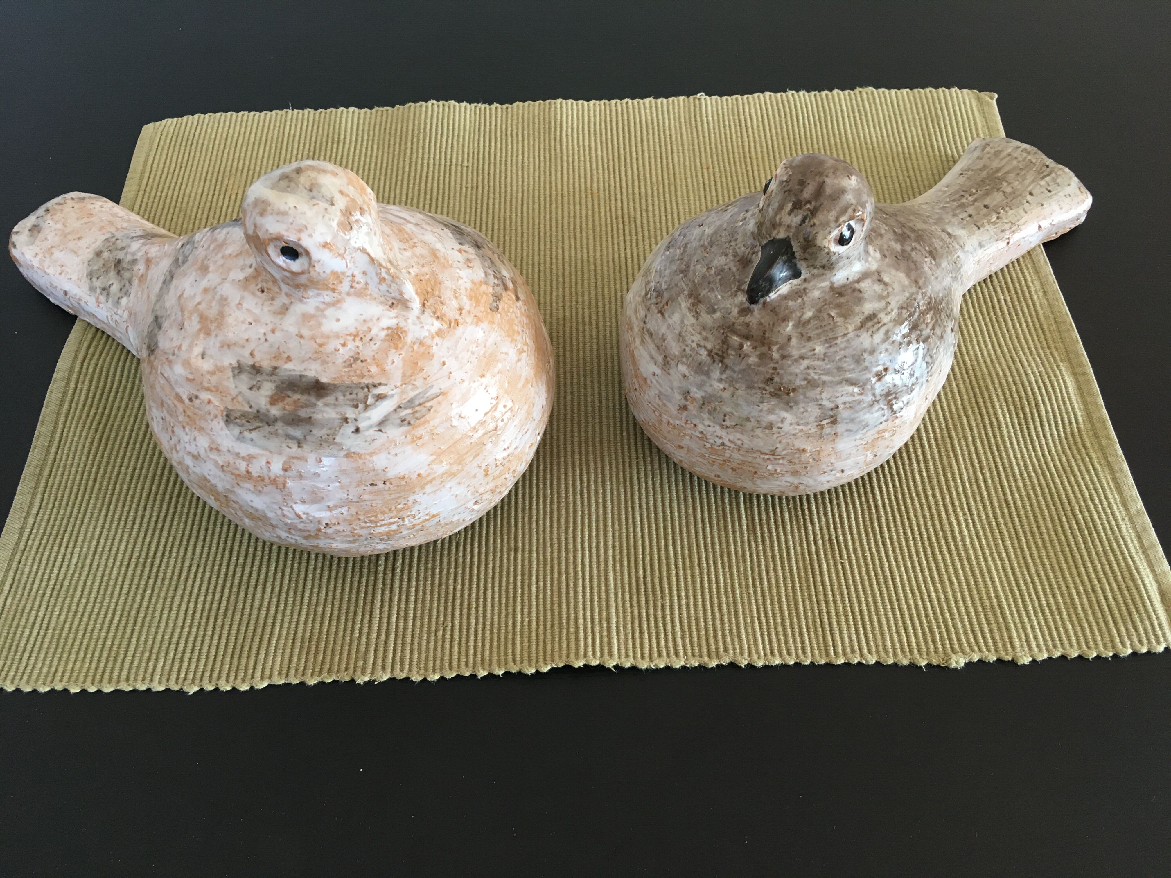 Pairs of birds in ceramic signed