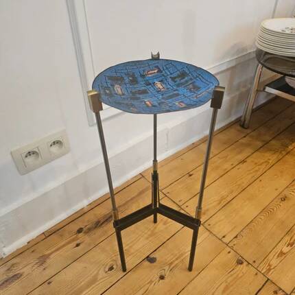 Vintage tripod metal side table with a blue brass bowl.