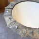 Brutalist round hammered gold metal mirror