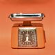 Stube - vintage household scale in orange painted metal - force 10 - 1960s