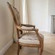 Pair of Voltaire armchairs in wood and floral fabric