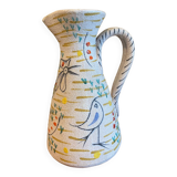 Pitcher with naive bird decor