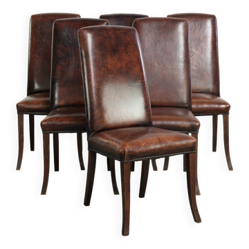 Ensemble de 6 chaises de salle à manger en peau de mouton au design intemporel.