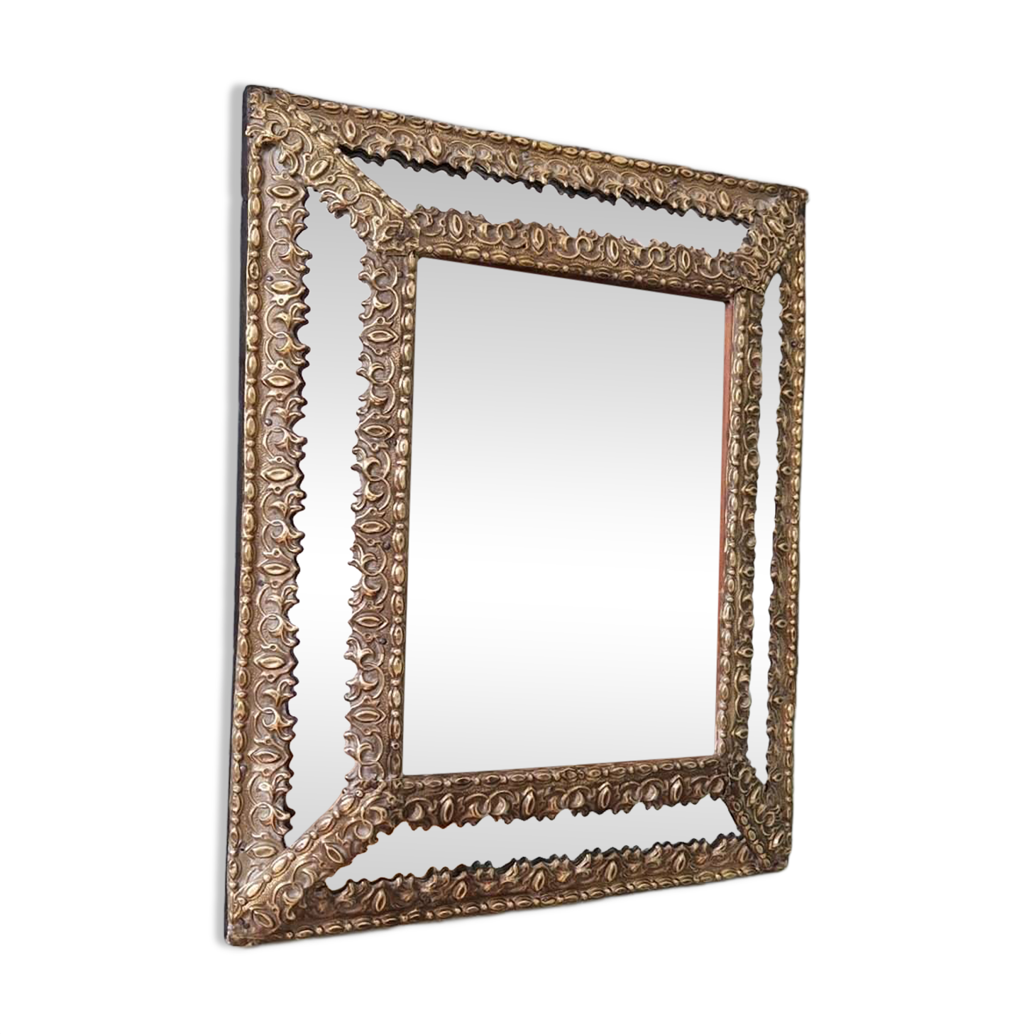 Mirror with repoussé brass frame, mercury glass, 19th century.