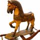 Ancient wooden rocking horse with original paint, hand-carved.