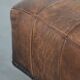 Beautiful sheepskin ottoman on high legs and beautiful warm colours