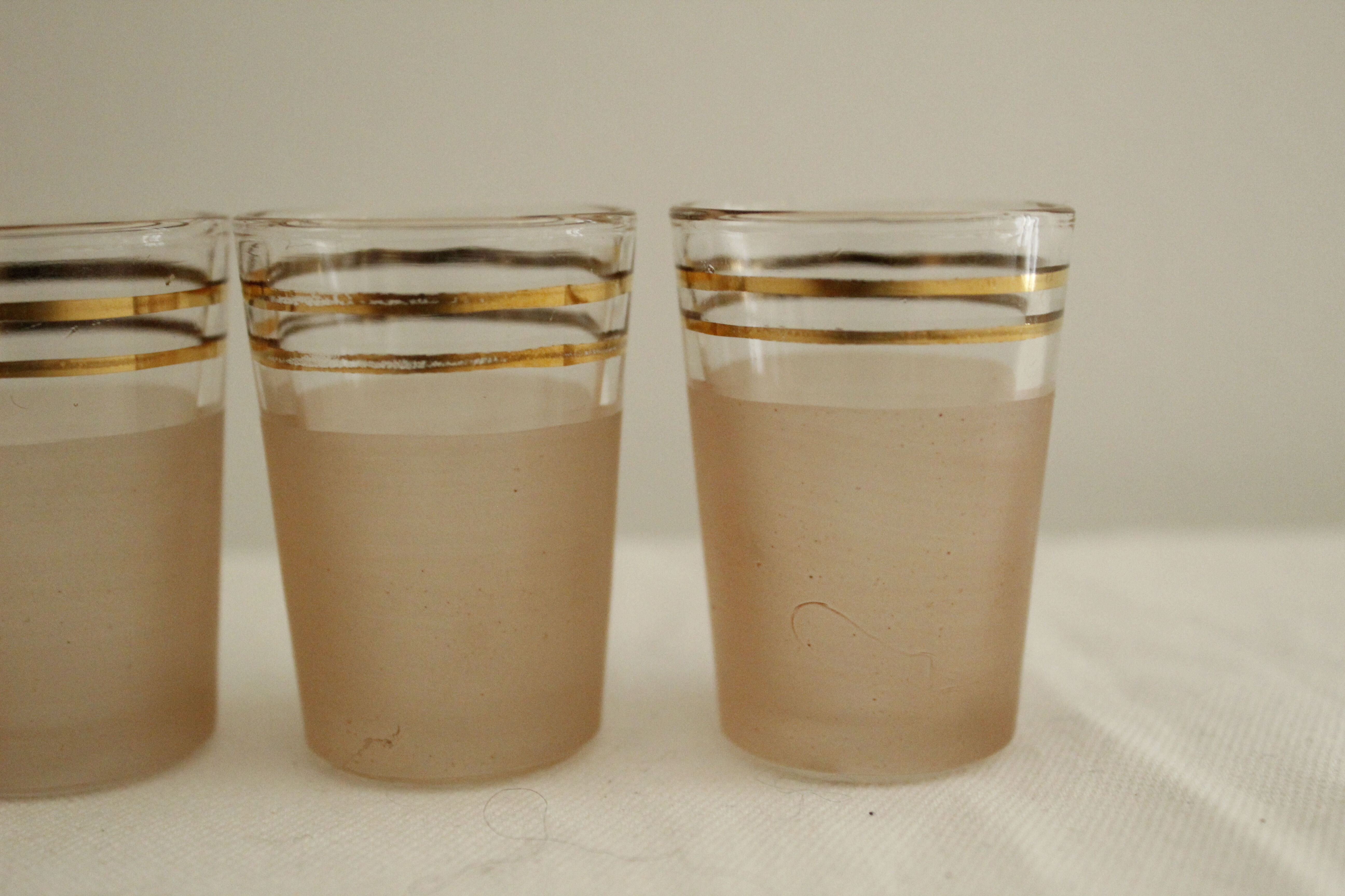 7 pink and gold vintage glass liquor glasses