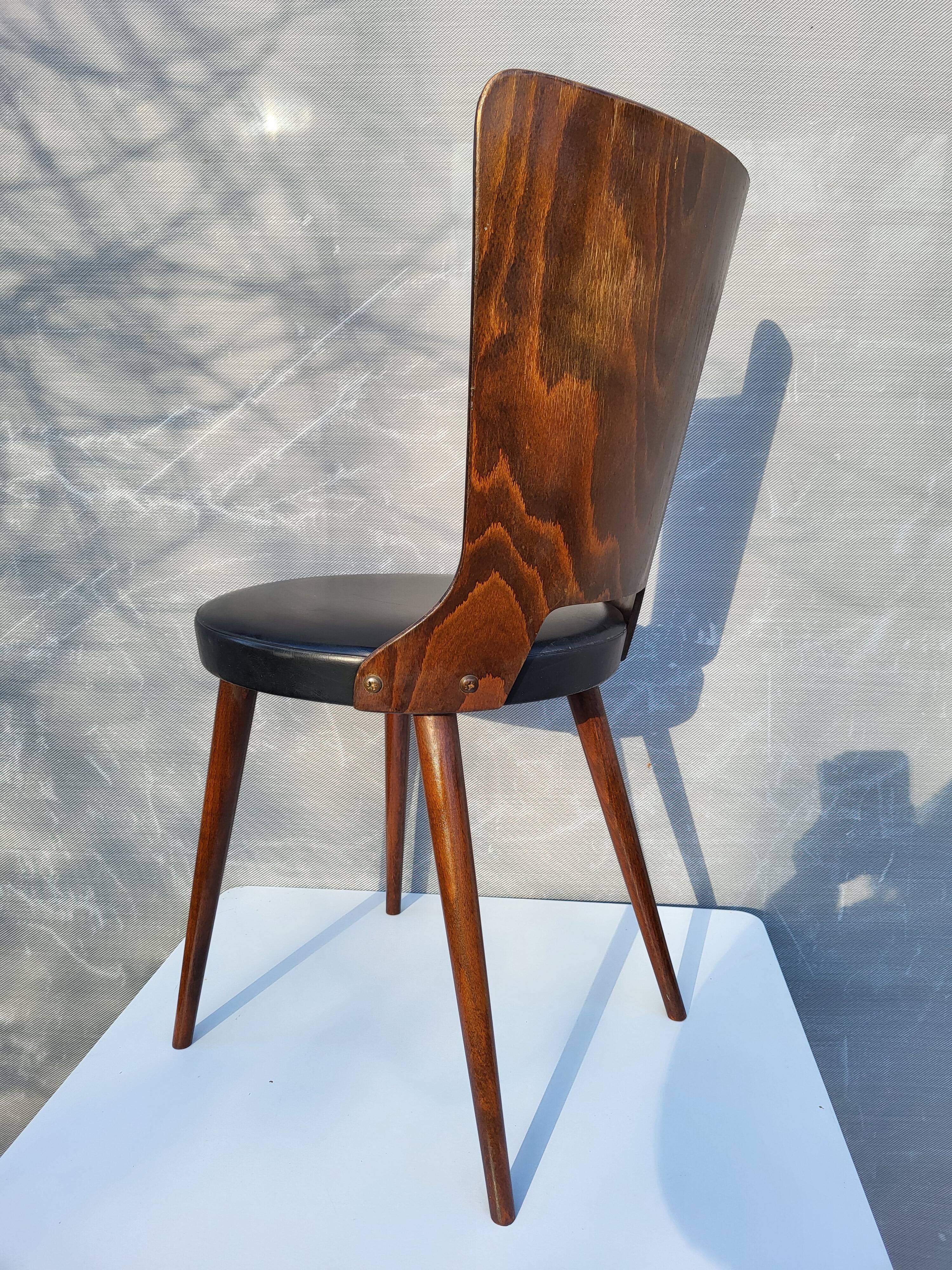 Pair of Dove chairs • Baumann • Black faux leather