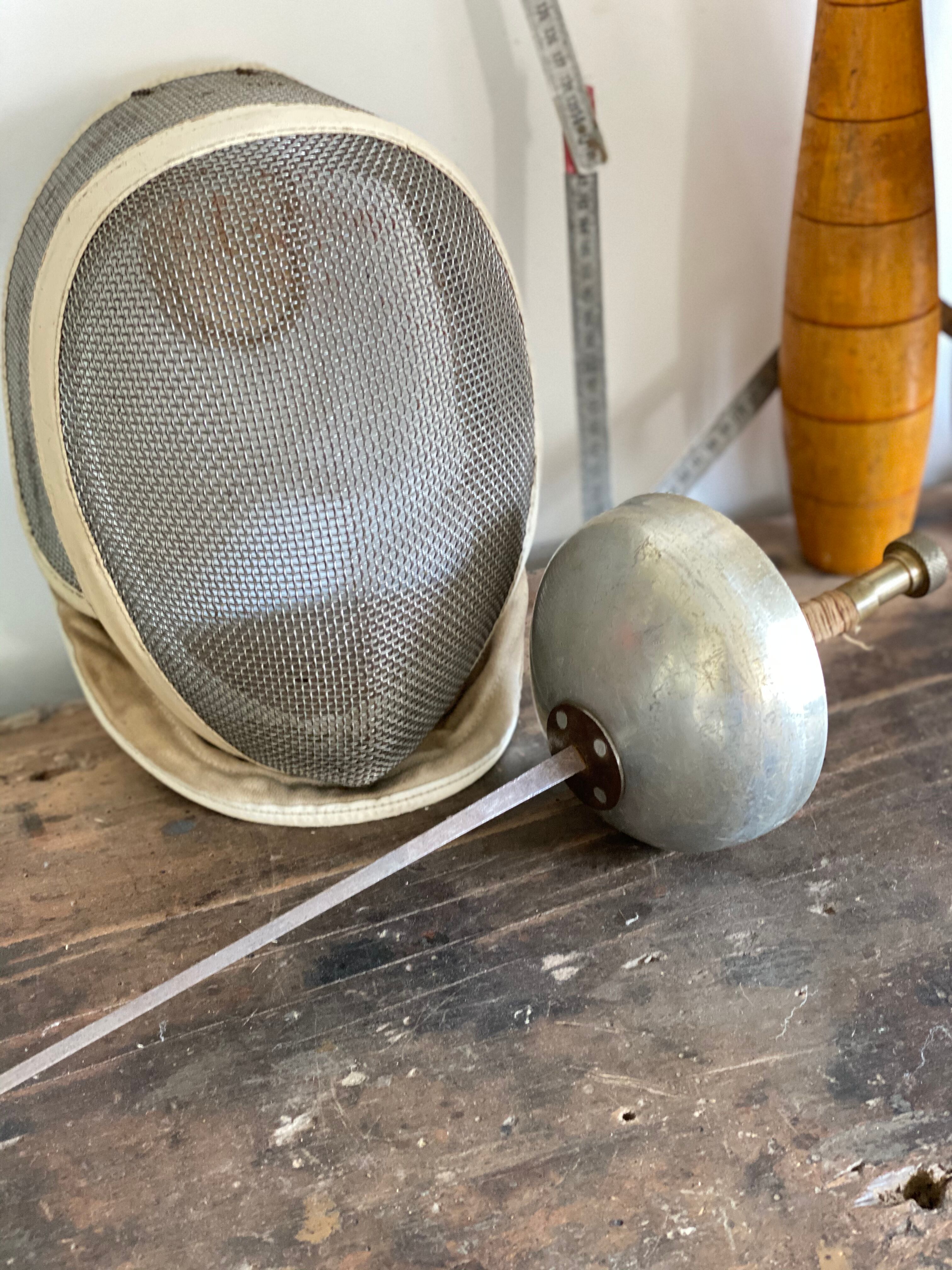 Old fencing mask set and its foil