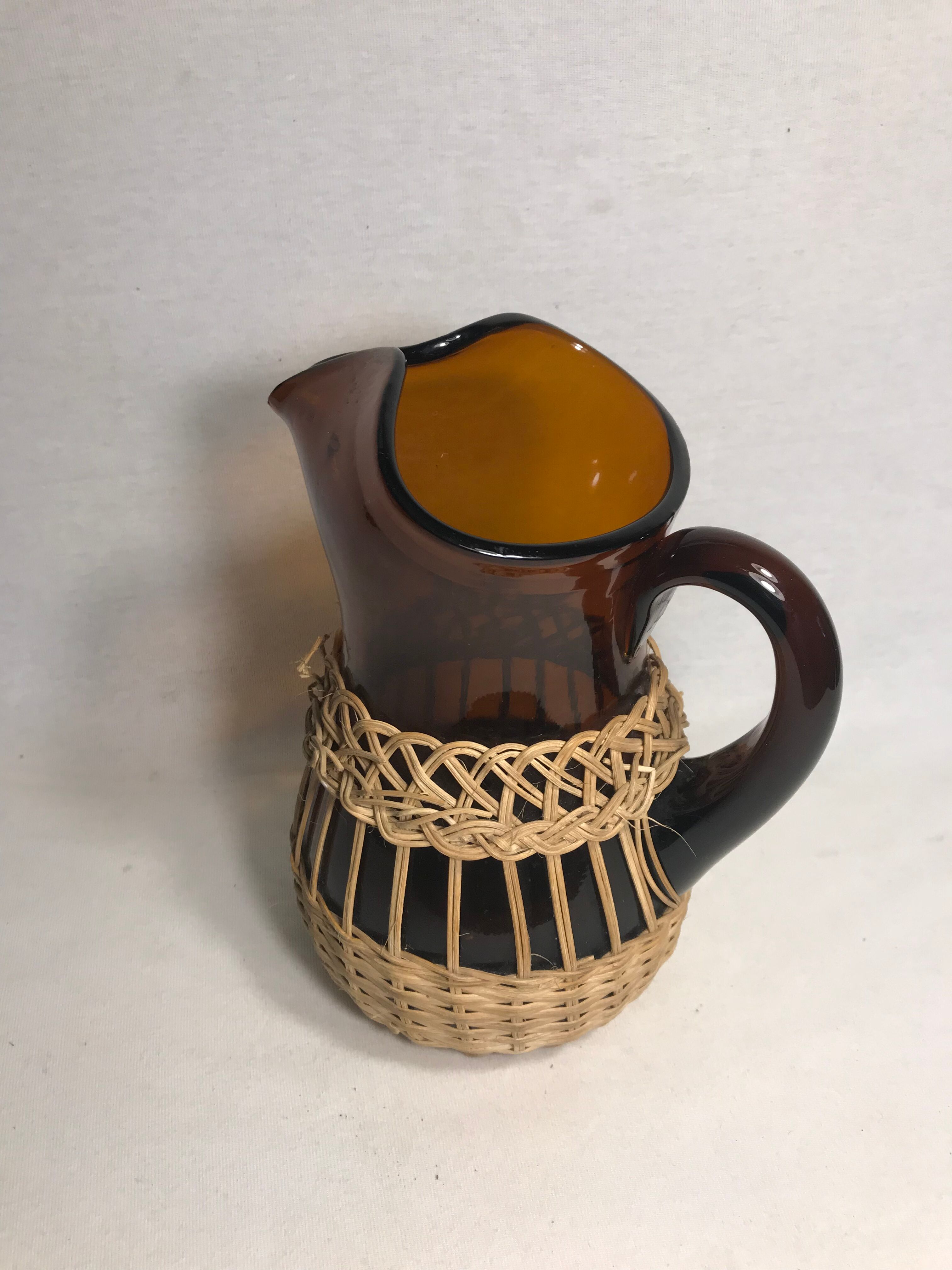 Service old juice carafe and its 9 orange glasses