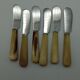 Twelve vintage butter knives