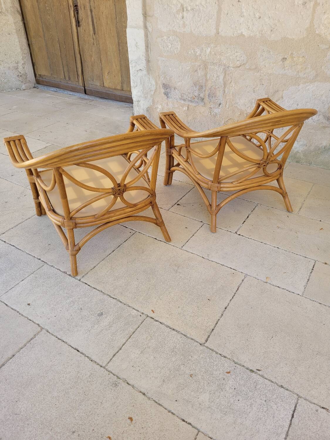 Two large rattan armchairs