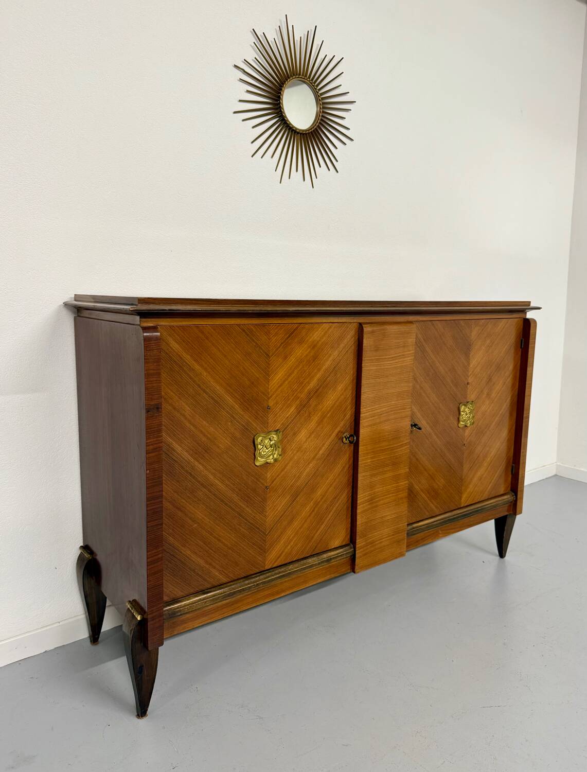 Antique art deco sideboard from the 1930s with veneered wood and bronze insert