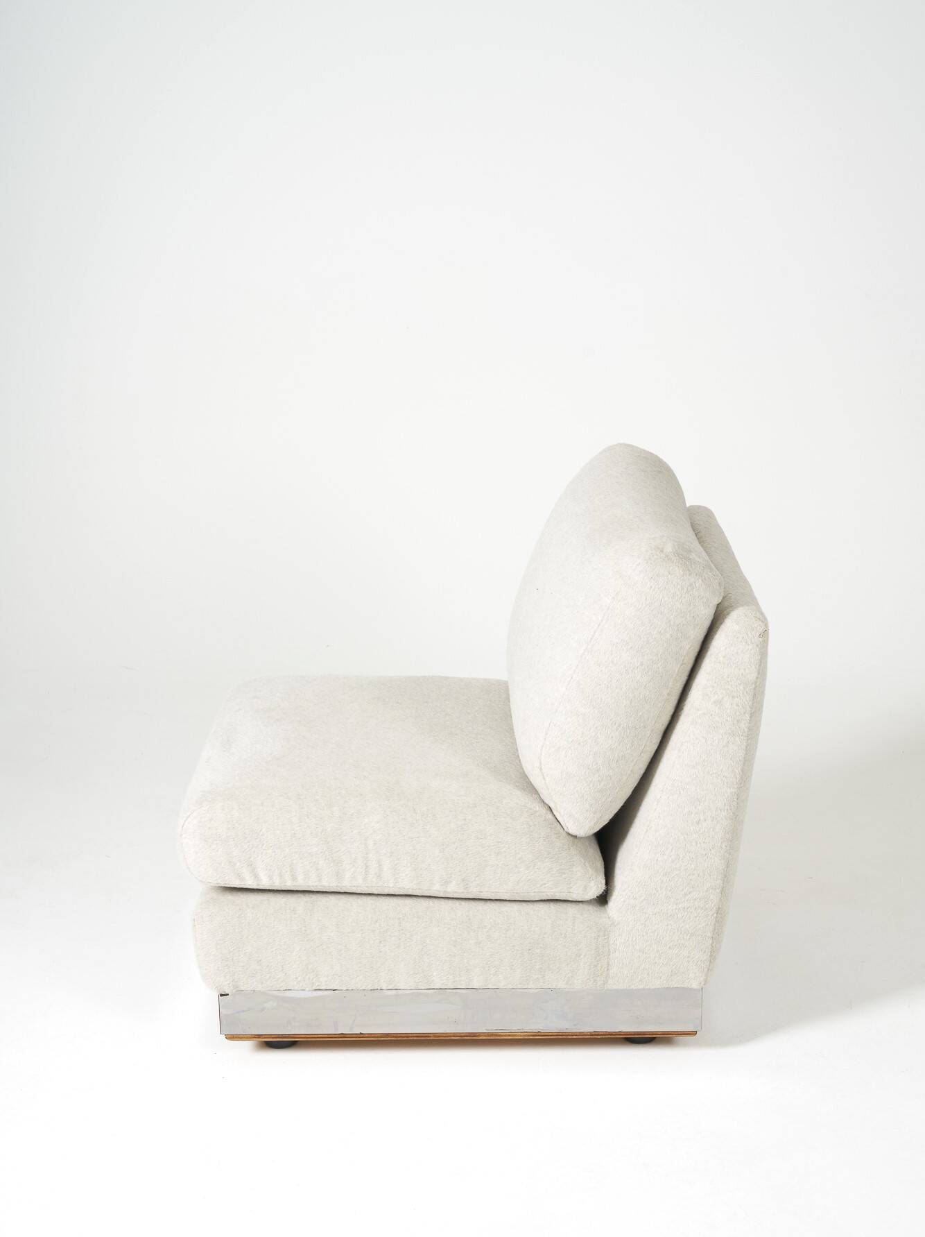 Beige fireside chair by Jacques Charpentier