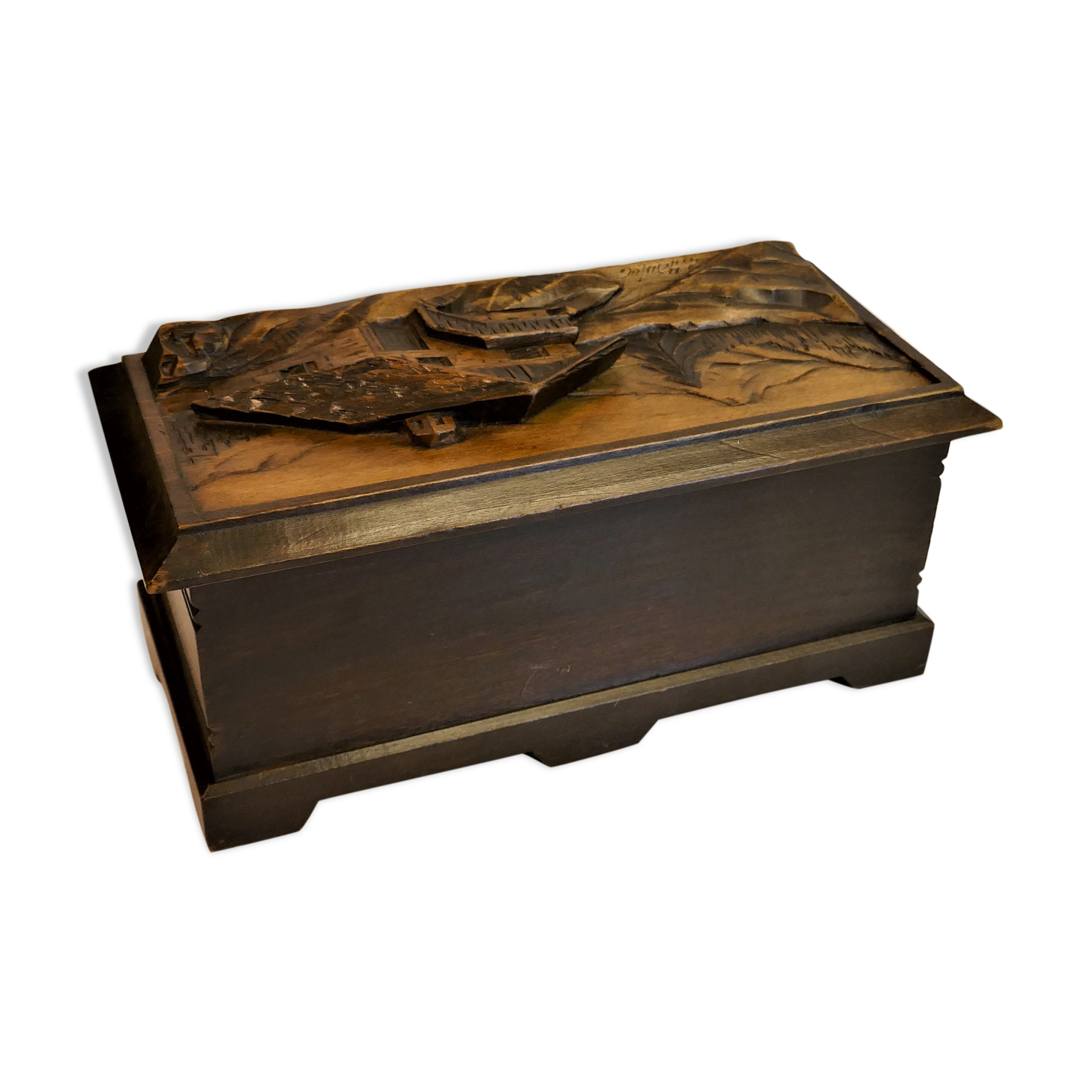 Vintage carved wooden box of a mountain landscape in relief