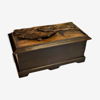 Vintage carved wooden box of a mountain landscape in relief