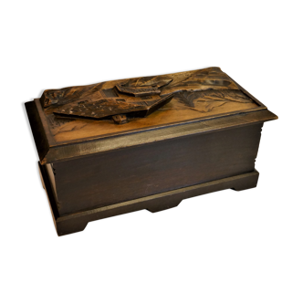 Vintage carved wooden box of a mountain landscape in relief