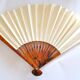 Vintage bamboo fan with floral decoration from China.