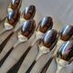 12 small silver-plated metal spoons by Guildart