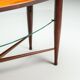 Assymetrical coffeetable with glass storage and cross leg details
