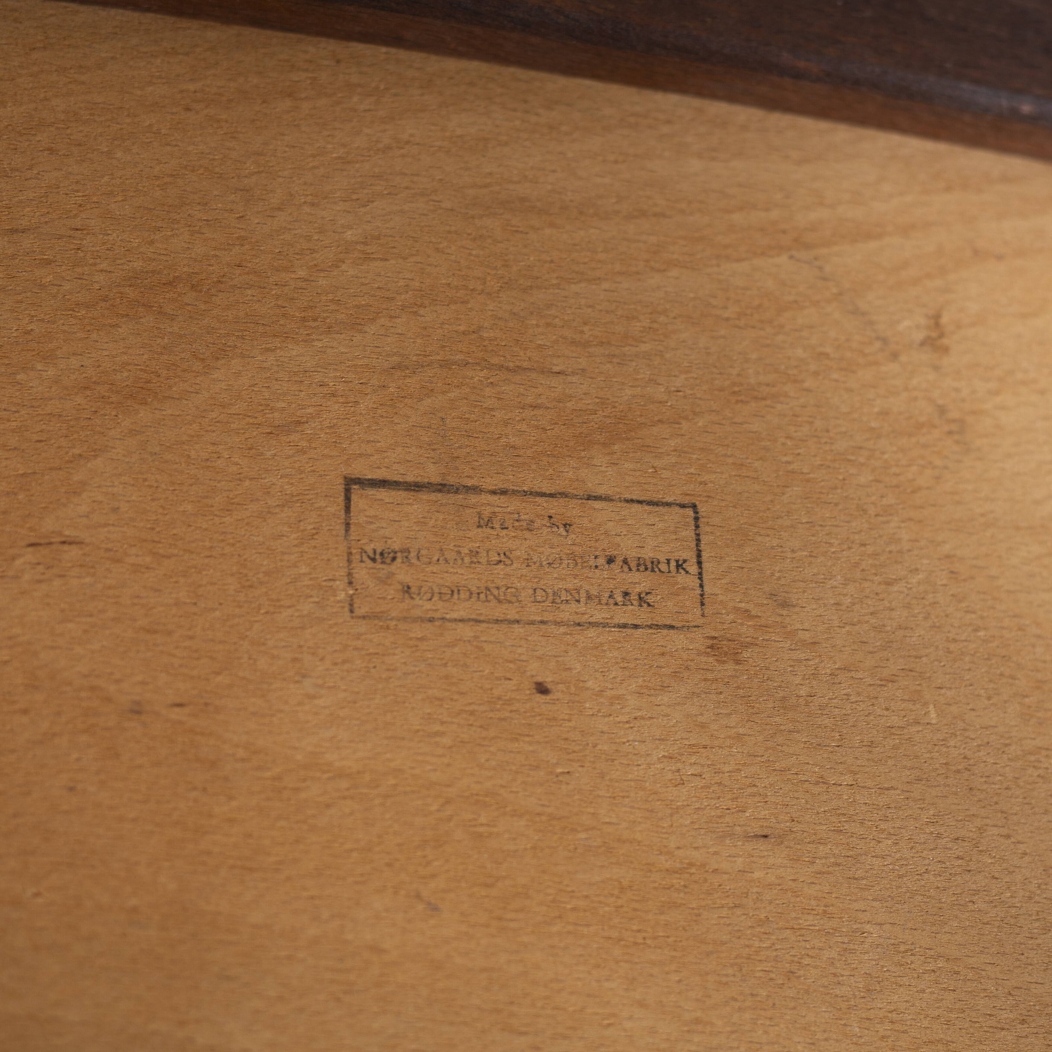 Armchair in rosewood and black leather, by J. Norgaard, Denmark, 1960s