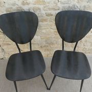 Pair of chairs with tapered metal legs and black Skaï, 60s