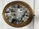 Antique oval mirror in gilded wood, bevelled mercury glass, 19th century.