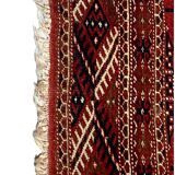 Red wool carpet, geometric pattern.