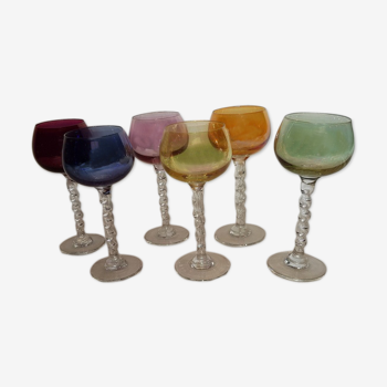 Set of 6 old glasses of different colors with twisted foot