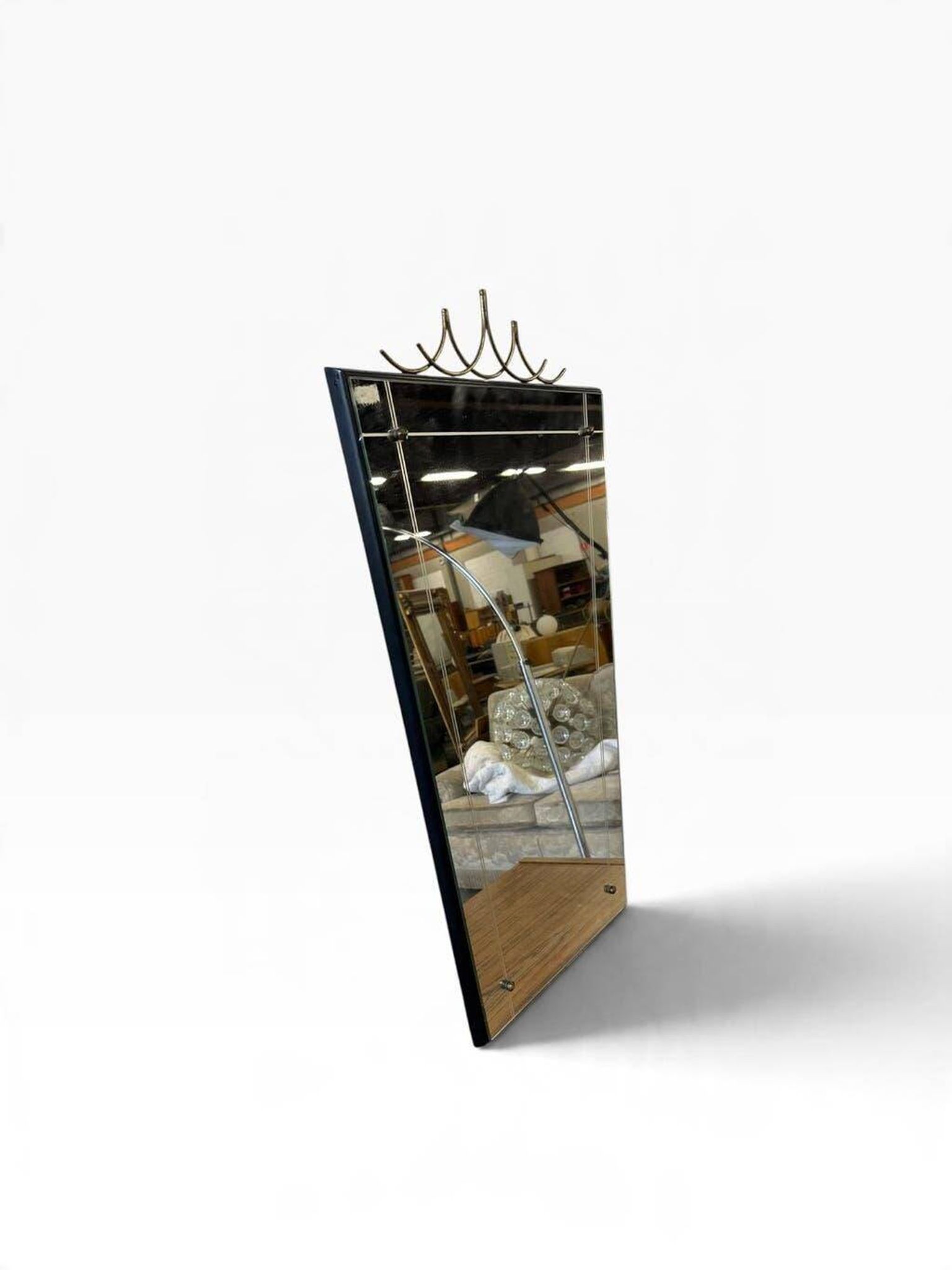 Elegant black wall mirror in vintage style with brass accents.