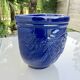 Wall pot in glazed blue terracotta with a grape design, 1970s.