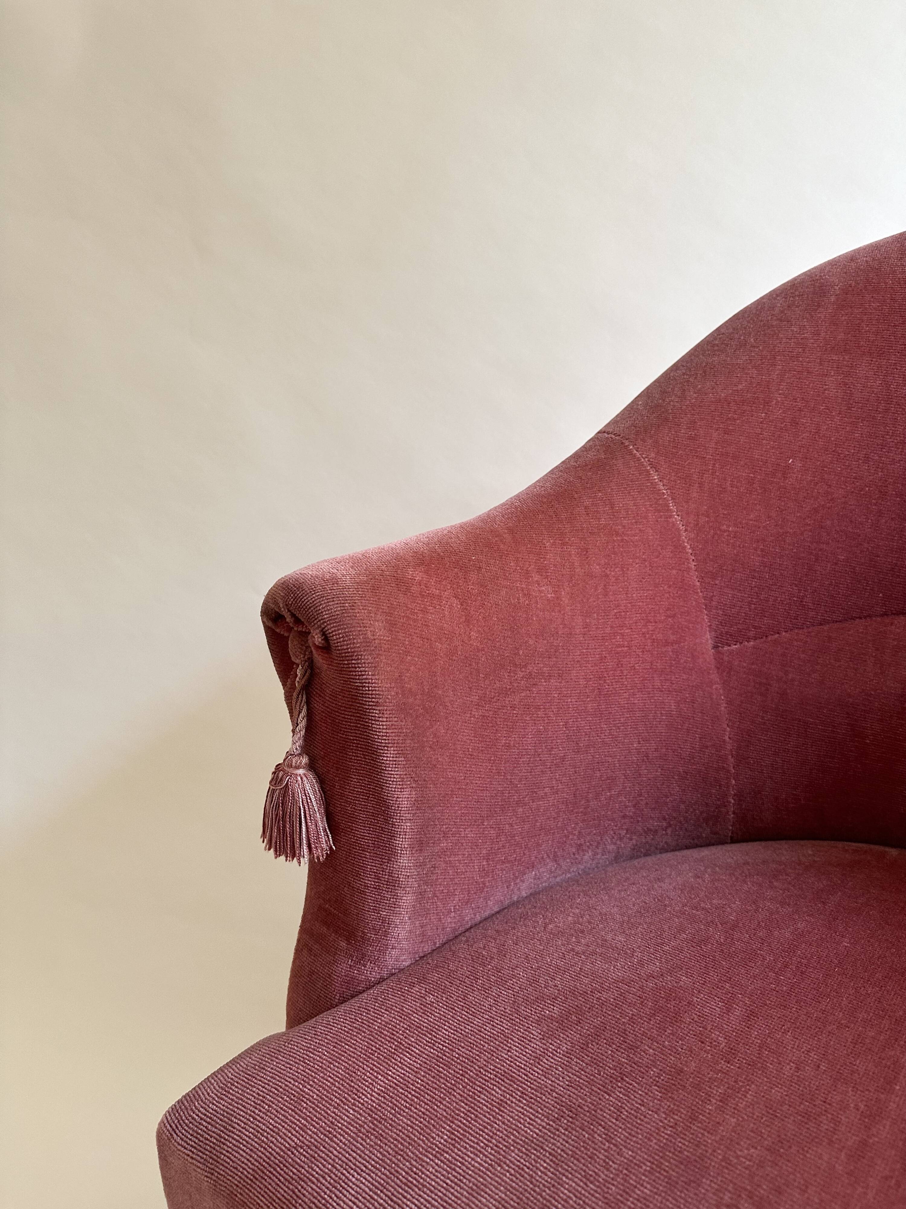 Pink-orange velvet tub chair