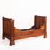 Bed made of solid walnut with marquetry details. France, 1930s.