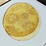 Glass plate decorated with suns, 1980.