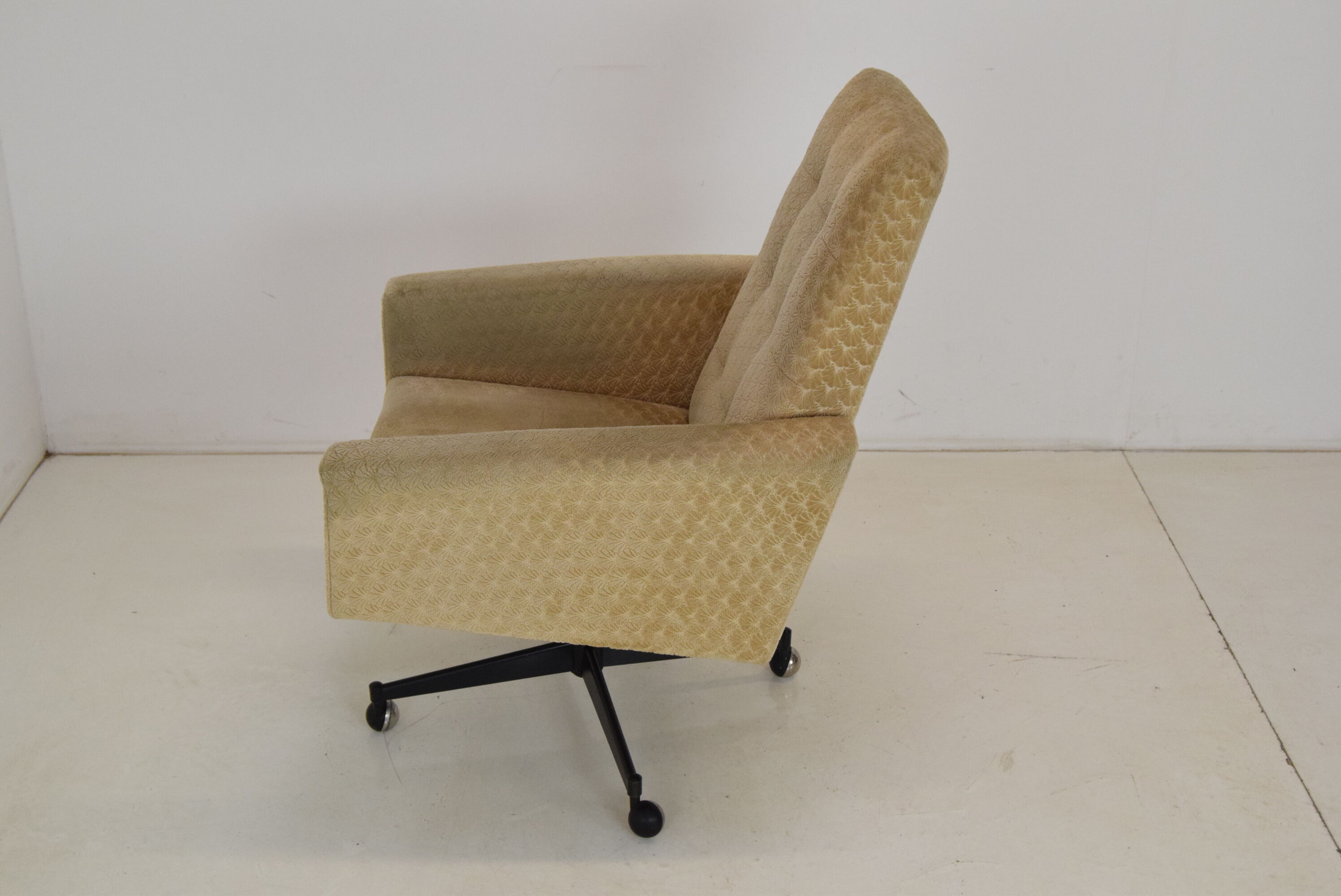 Mid-century swivel armchair with wheels 1970's