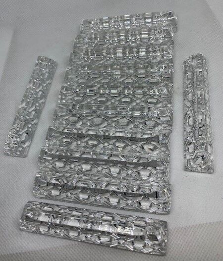 12 knife holders in cut crystal triangular shape