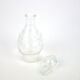 Small bottle with a glass cap with geometric patterns