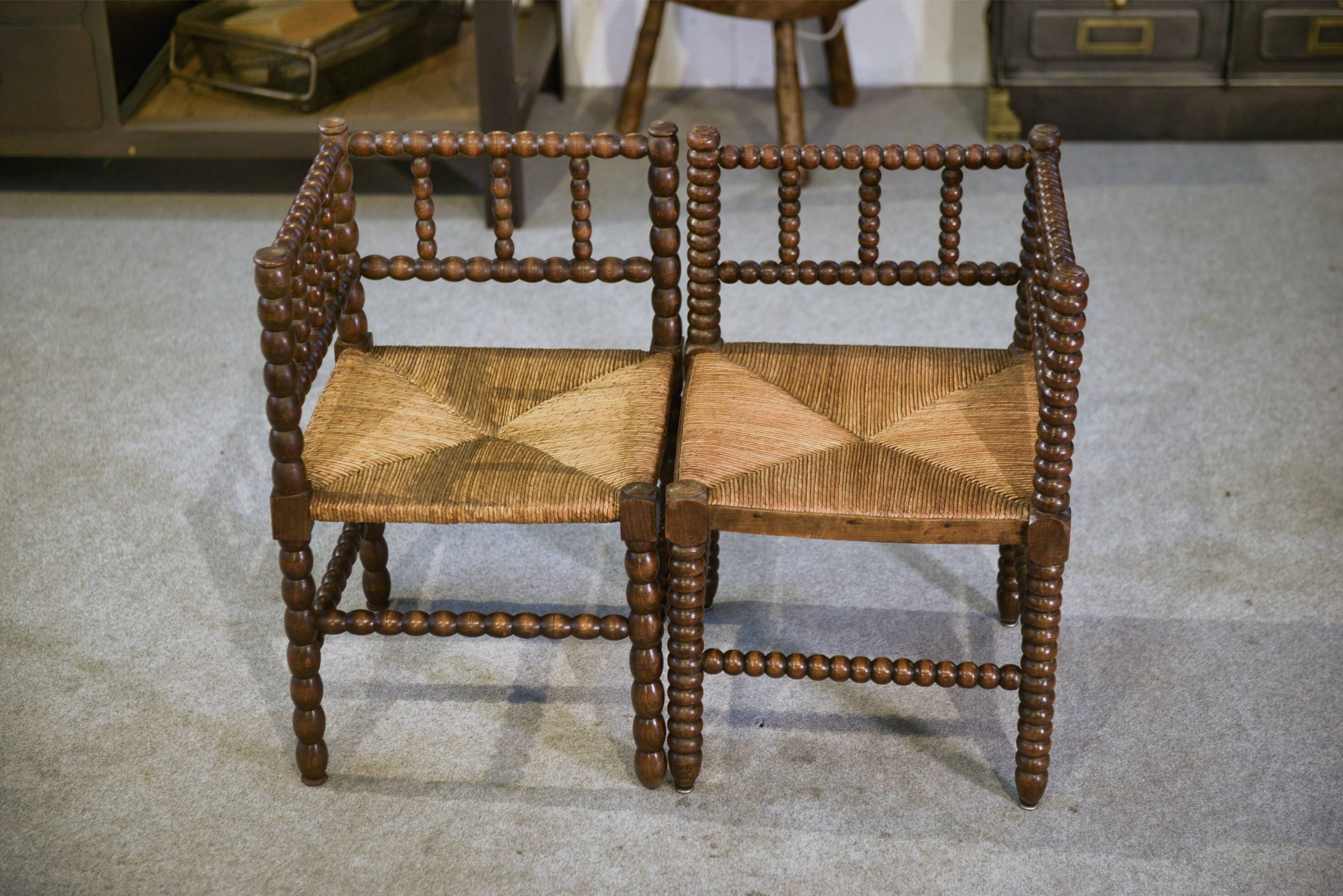 Pair of turned wooden corner chairs from the 1950s.