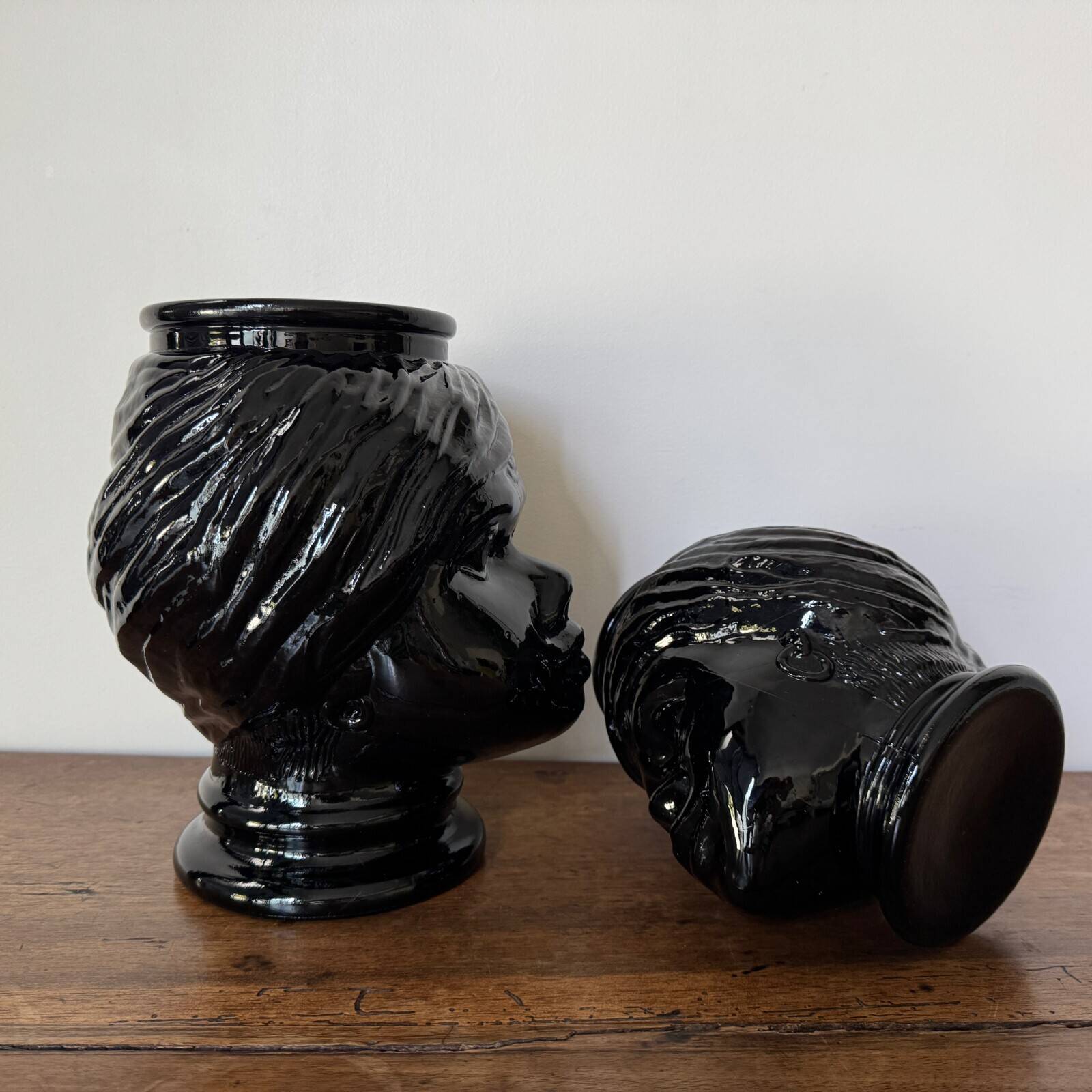 2 glass heads representing Moors