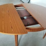 Teak round table with extension cords