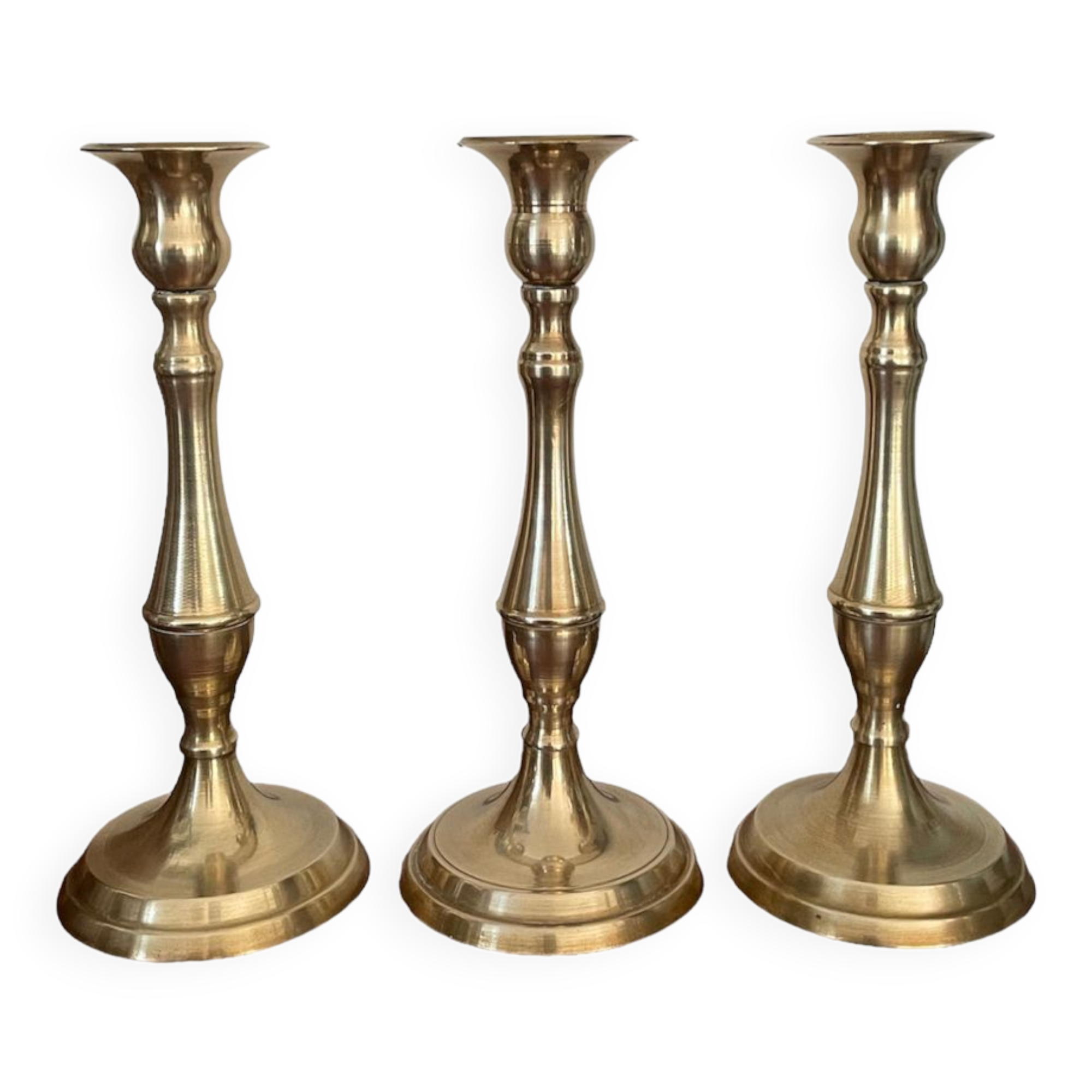 Set of three vintage brass candlesticks