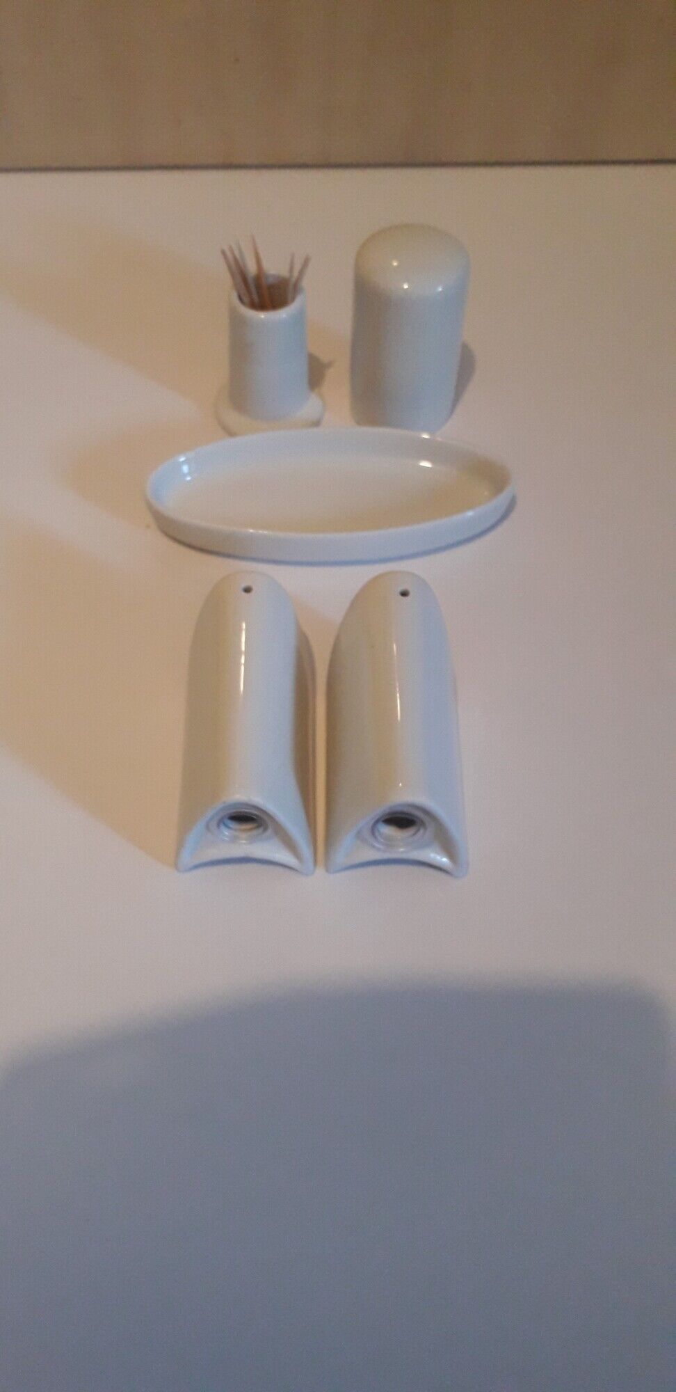 Set salt shaker, pepper tree and covered ceramic pot on small tray