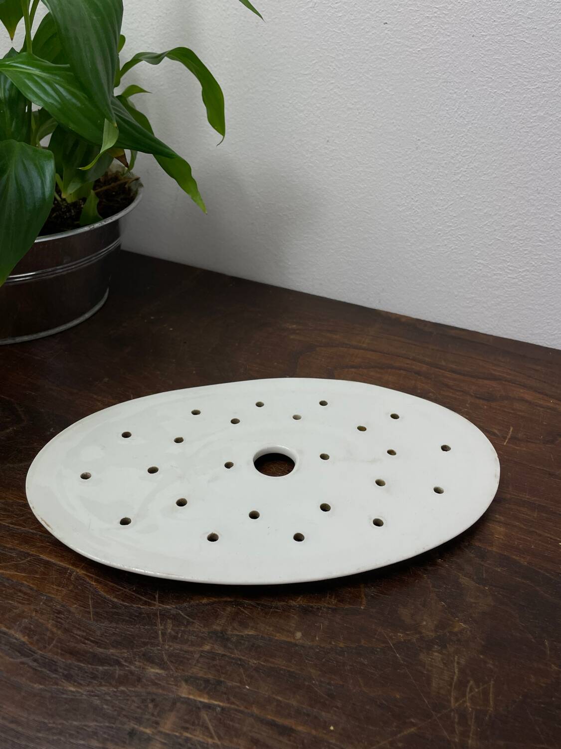 Old iron clay draining plate